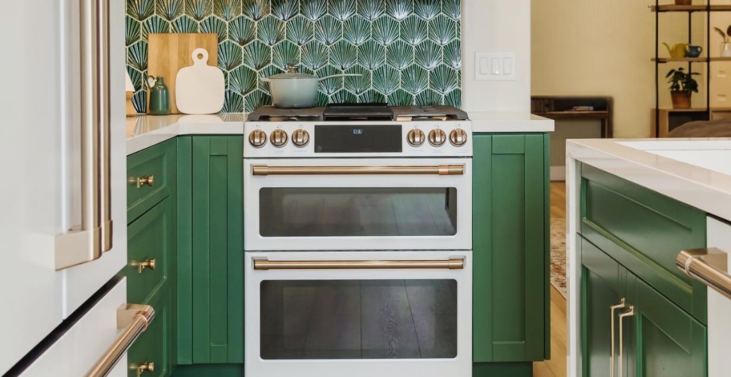 green chic kitchen with cooktop range in center